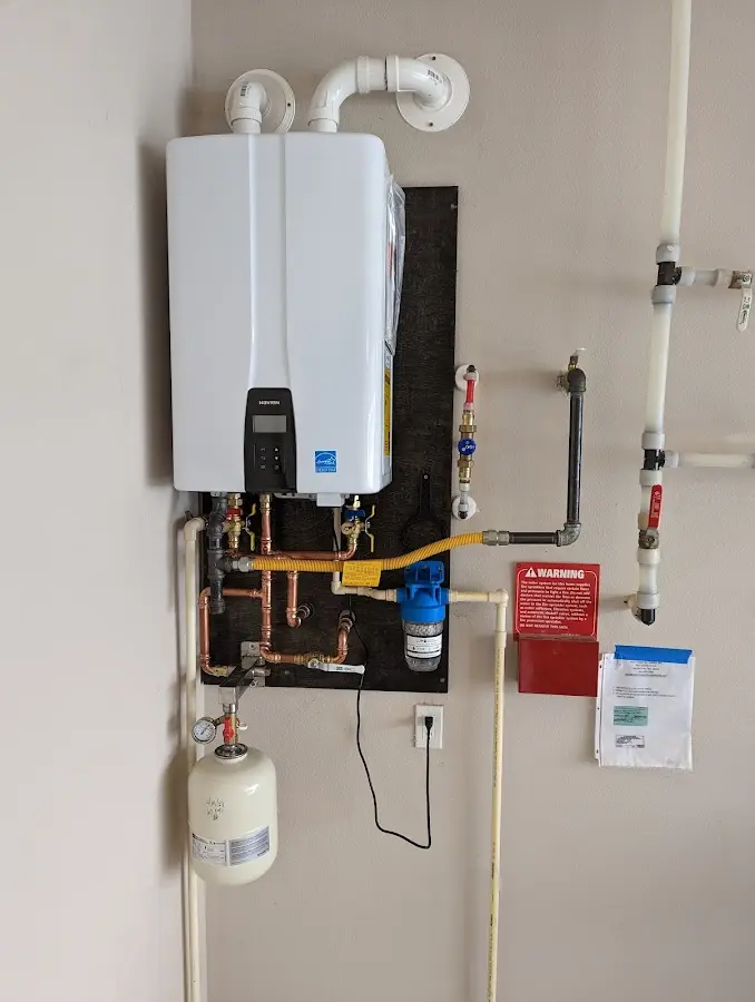 Professional plumber installing copper piping in a Starkville home